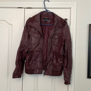 Maroon faux leather number jacket. Pleather is wearing at creases and folds
